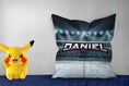 Load image into Gallery viewer, Personalized pillow with "Daniel," showing a hockey rink design, pikachoo soft toy on side
